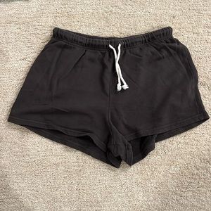 Perfectwhitetee dark grey terry sweat shorts with a drawstring. Women’s size M